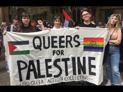 Photo of women holding up a "Queers for Palestine" banner.