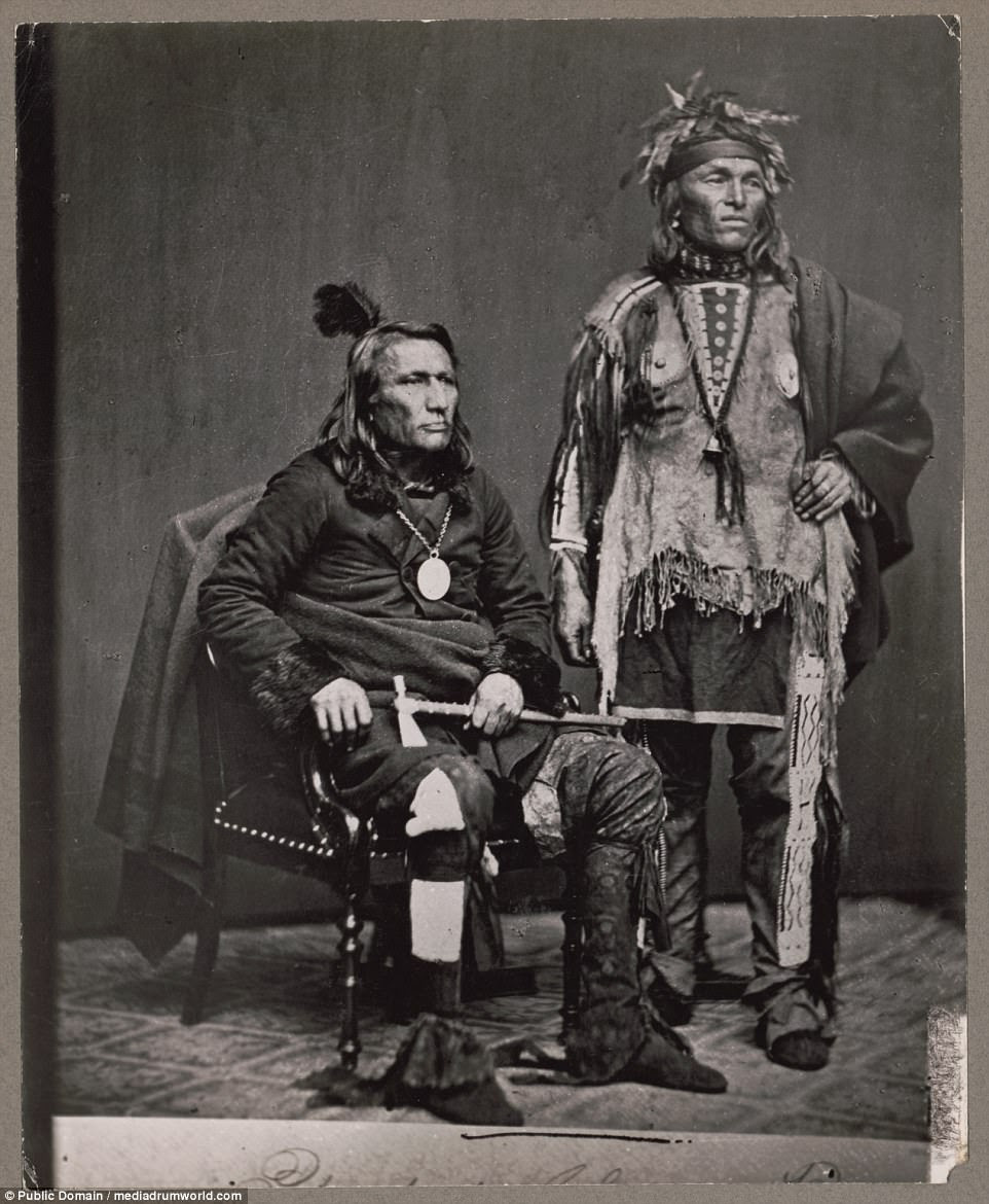 Chief Crane of the Potawatomi, holding tomahawk and with unidentified Native American man in a delegation to Washington, D.C,  in 1860