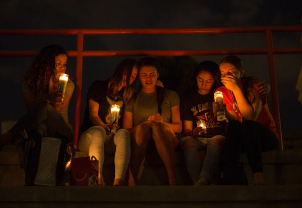 Mourners taking part in a vigil at El Paso High School.