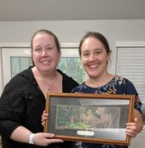 Action Plan Coordinator Allie McCue presents FWLI Biologist Anna Deyle with the 2019 Christine Small Award