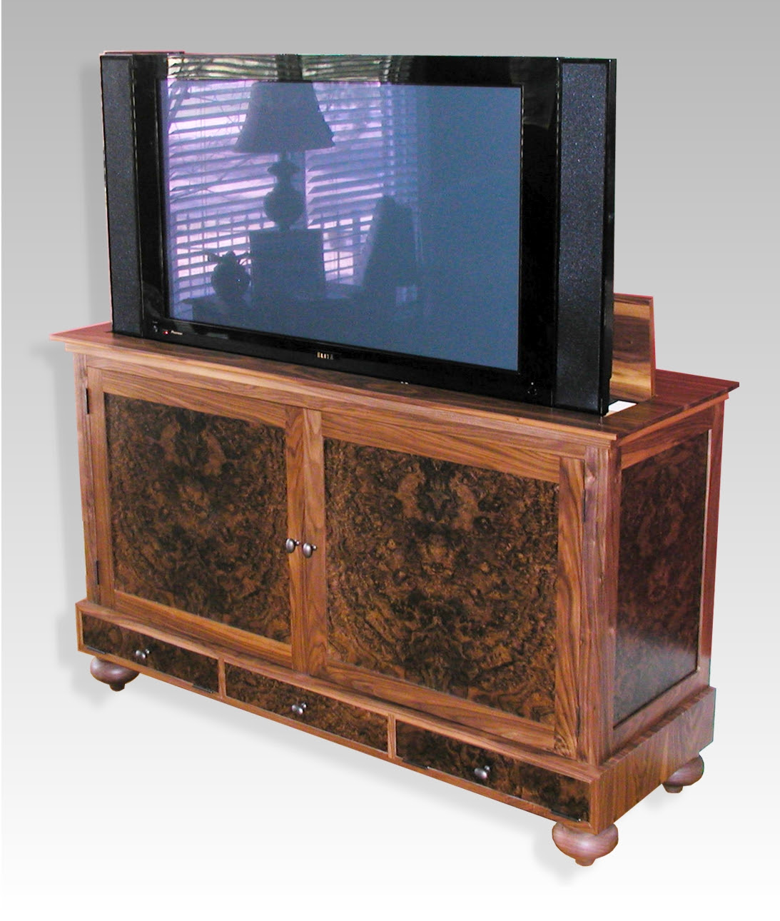 Here's a design you can make yourself. Plasma Tv Lift Cabinet By Rj Fine Woodworking
