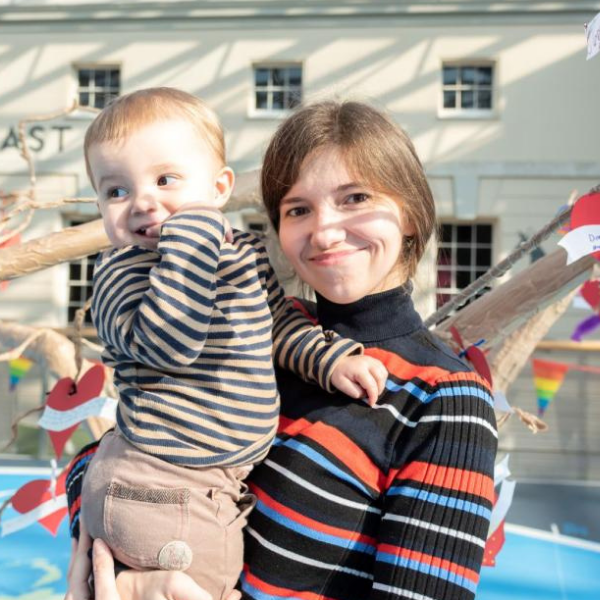 A woman and baby smiling in the National Maritime Museum