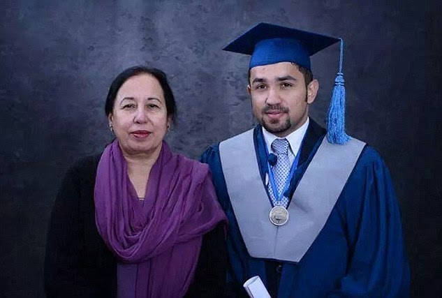 Proud mother: Tahira Qazi, the principal of the Army Public School and College in Peshawar, with her son, Ahmad, at his graduation ceremony in Peshawar.