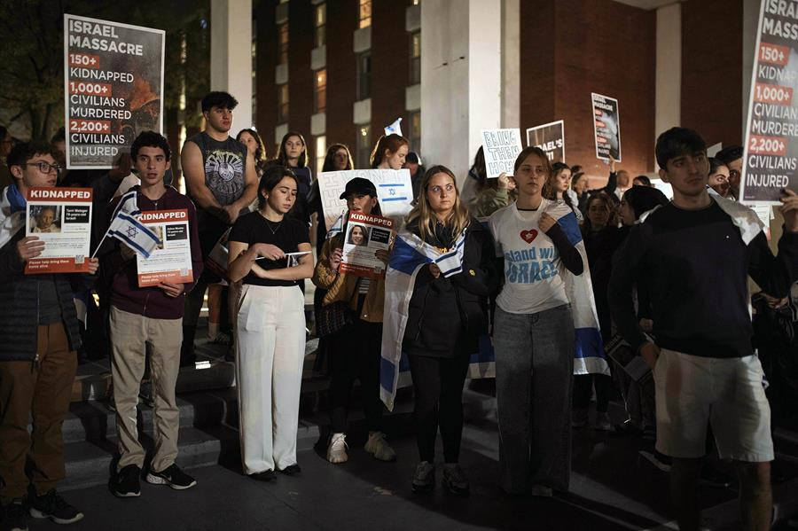 Jewish Rutgers University students and members of the community gather holding placards and flags to hold solidarity and vigil for Israel.