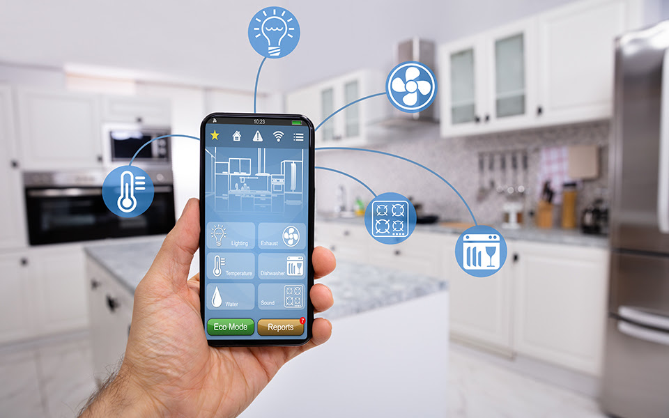 Illustration of a smartphone being held in a kitchen, with icons showing fan, lights, etc.