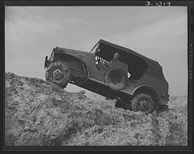 Army truck manufacture (Dodge). Army trucks must be capable of getting through, even in the worst possible operating conditions. Above is shown a Dodge Army truck climbing a tremendously steep grade over soft ground that gives the poorest kind of traction