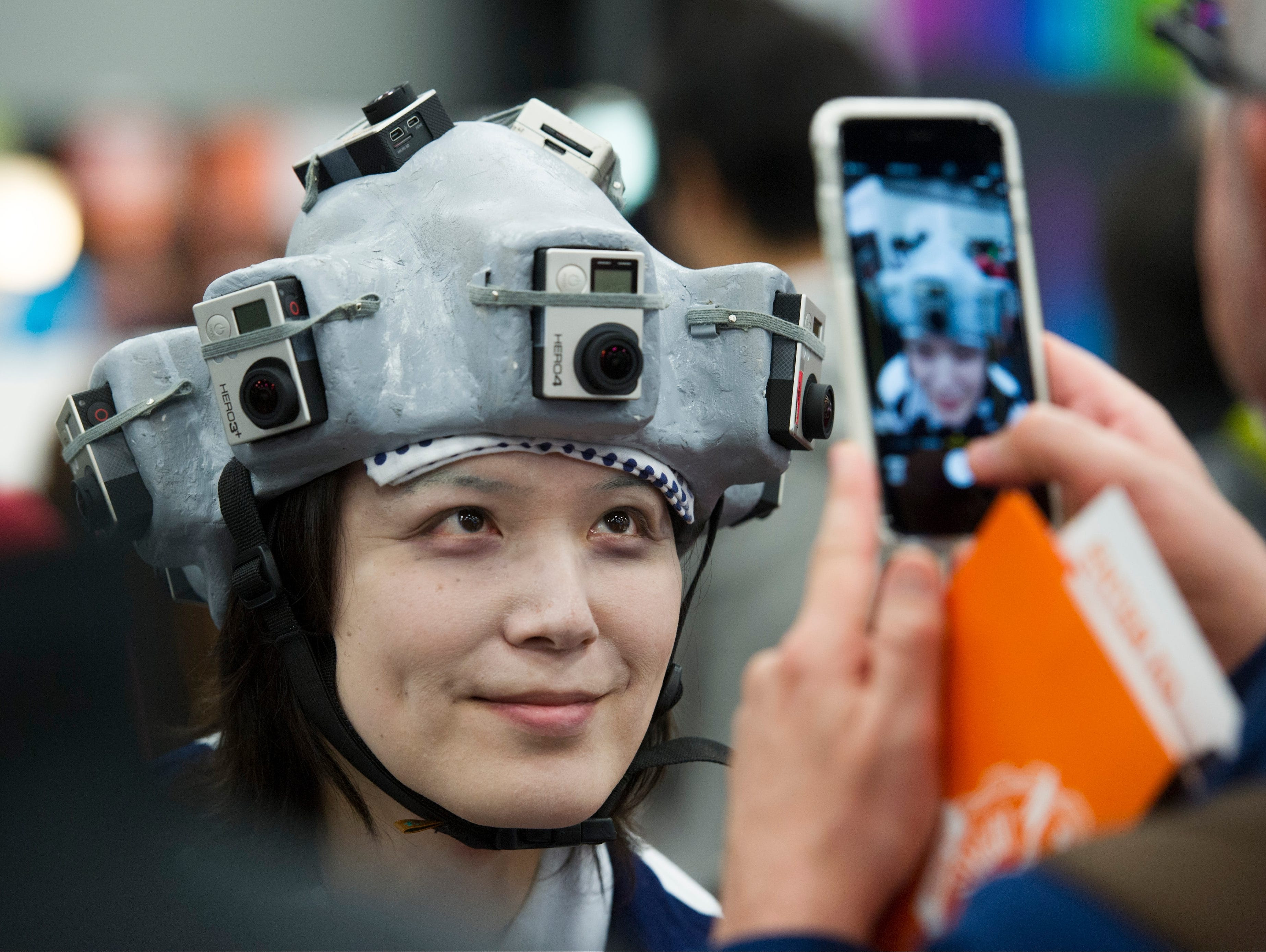 Dverse CEO and Founder Shogo Numakara's image is captured on Day 2 of the SXSW Trade Show, March 15, 2015, in Austin.  Numakara wears a 360-degree panoramic movie headset utilizing ten GoPro devices attached to a helmet to record panoramic movies.