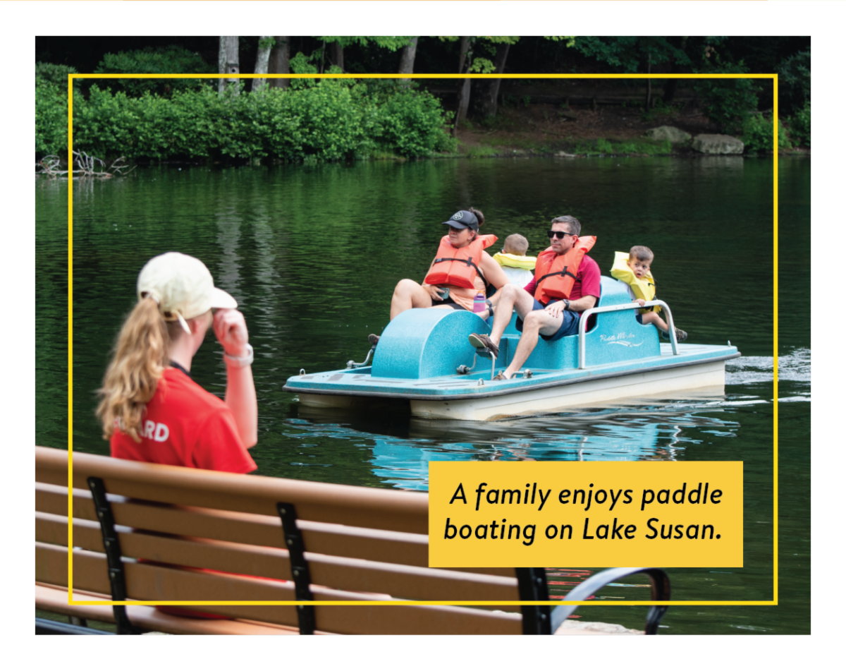 A family enjoys paddle boating on Lake Susan.