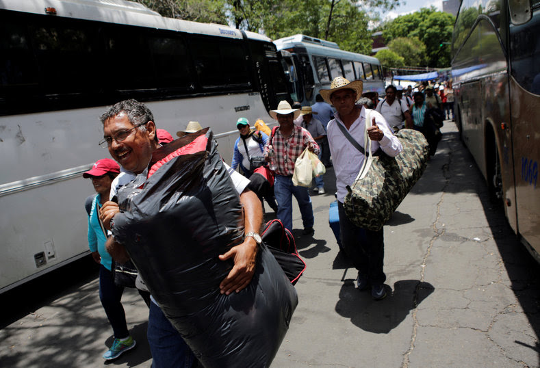 Protesters from the National Coordinator of Education Workers (CNTE) teachers’ union arrive in Mexico City to attend a march against President Enrique Peña Nieto