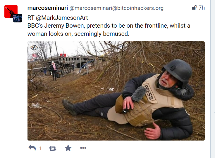 Tweeting showing BBC reporter cowering in fear to make the war look worse than it is while people in background go about their daily lives.