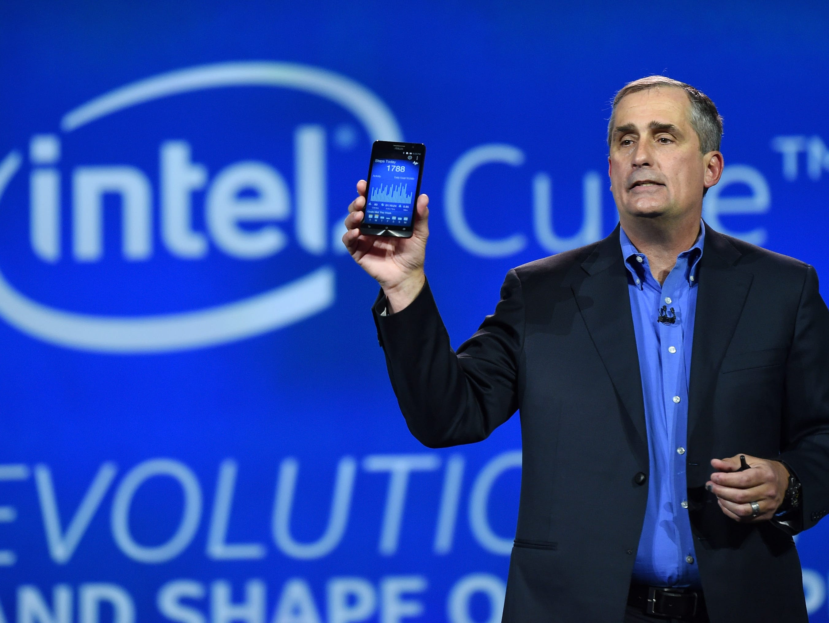 Intel CEO Brian Krzanich shows how many steps he took during a keynote address as tracked by a wearable processor called Curie, a prototype open source computer the size of a button that he unveiled at the 2015 International CES at The Venetian Las V