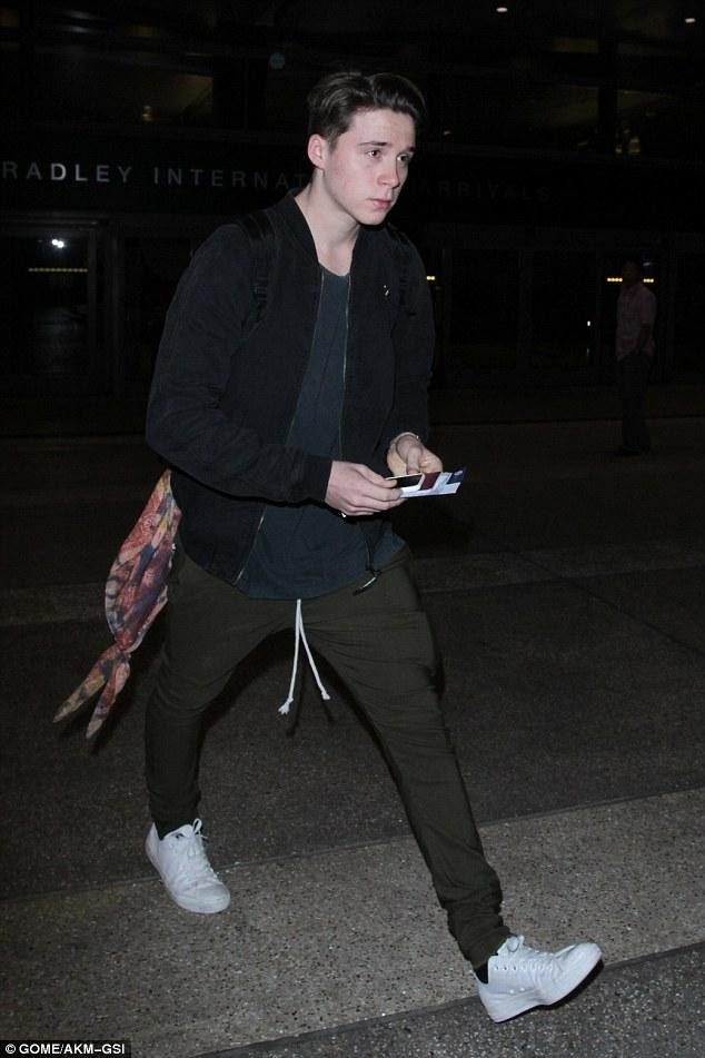 Fresh off photographing his debut b. Brooklyn Beckham Lax Airport October 22 2016 Star Style Man
