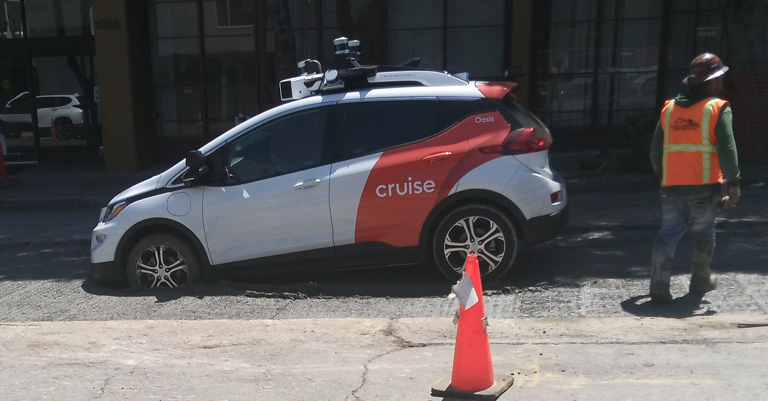 A Cruise robotaxi stuck in cemment.