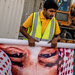 Workers preparing an image of King Salman, Saudi Arabia's new monarch of several months, to put up in a building in Riyadh.