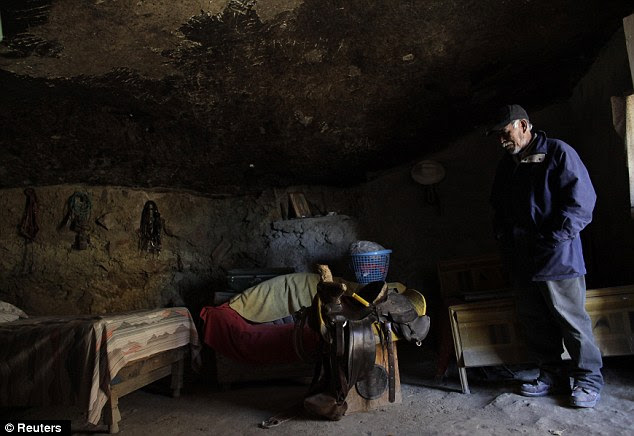 Humble: Hernandez stands inside his family's bedroom at the home he has lived in for over 30 years