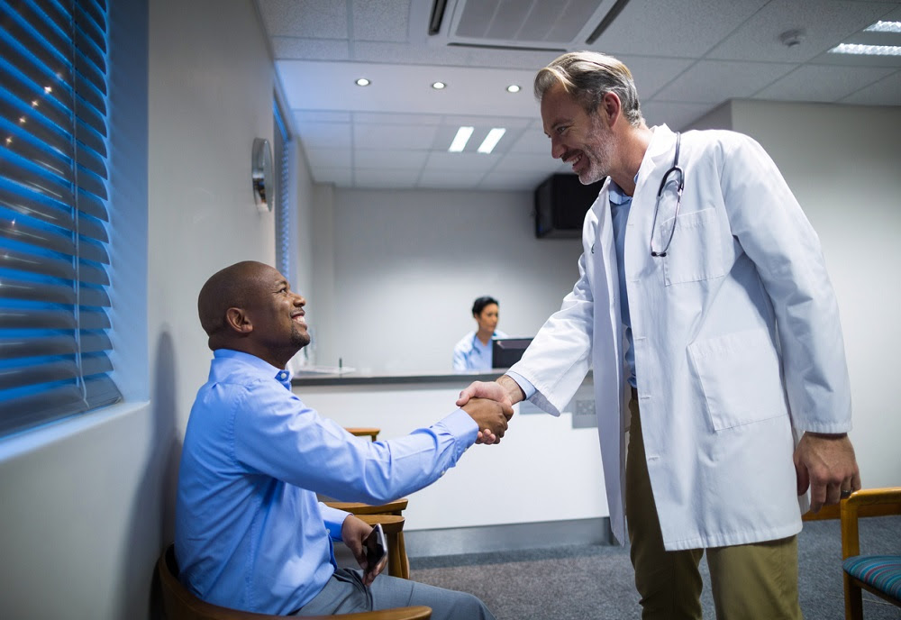 Doctor and patient shaking hands