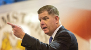 Secretary Walsh, gesturing emphatically while speaking. 