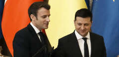 Ukrainian President Volodymyr Zelenskyy, right, and French President Emmanuel Macron leave after a joint press conference Tuesday, Feb. 8, 2022 in Kyiv, Ukraine. Diplomatic efforts to defuse the tensions around Ukraine continued on Tuesday with French President Emmanuel Macron in Kyiv the day after hours of talks with the Russian leader in Moscow yielded no apparent breakthroughs. (AP Photo/Thibault Camus, Pool)/PAR118/22039501136969/POOL PHOTO/2202081500