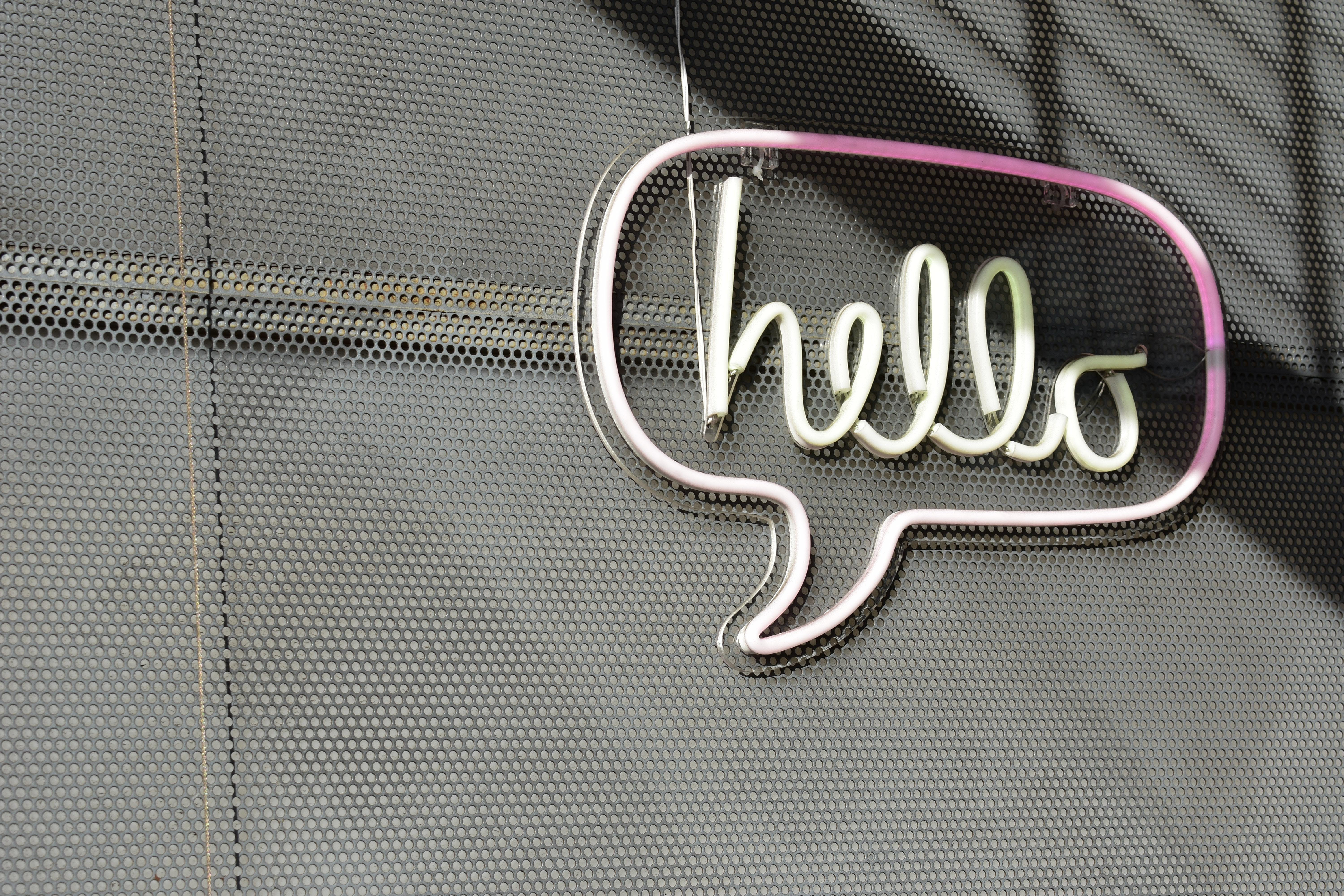 Neon sign spelling the word "hello"