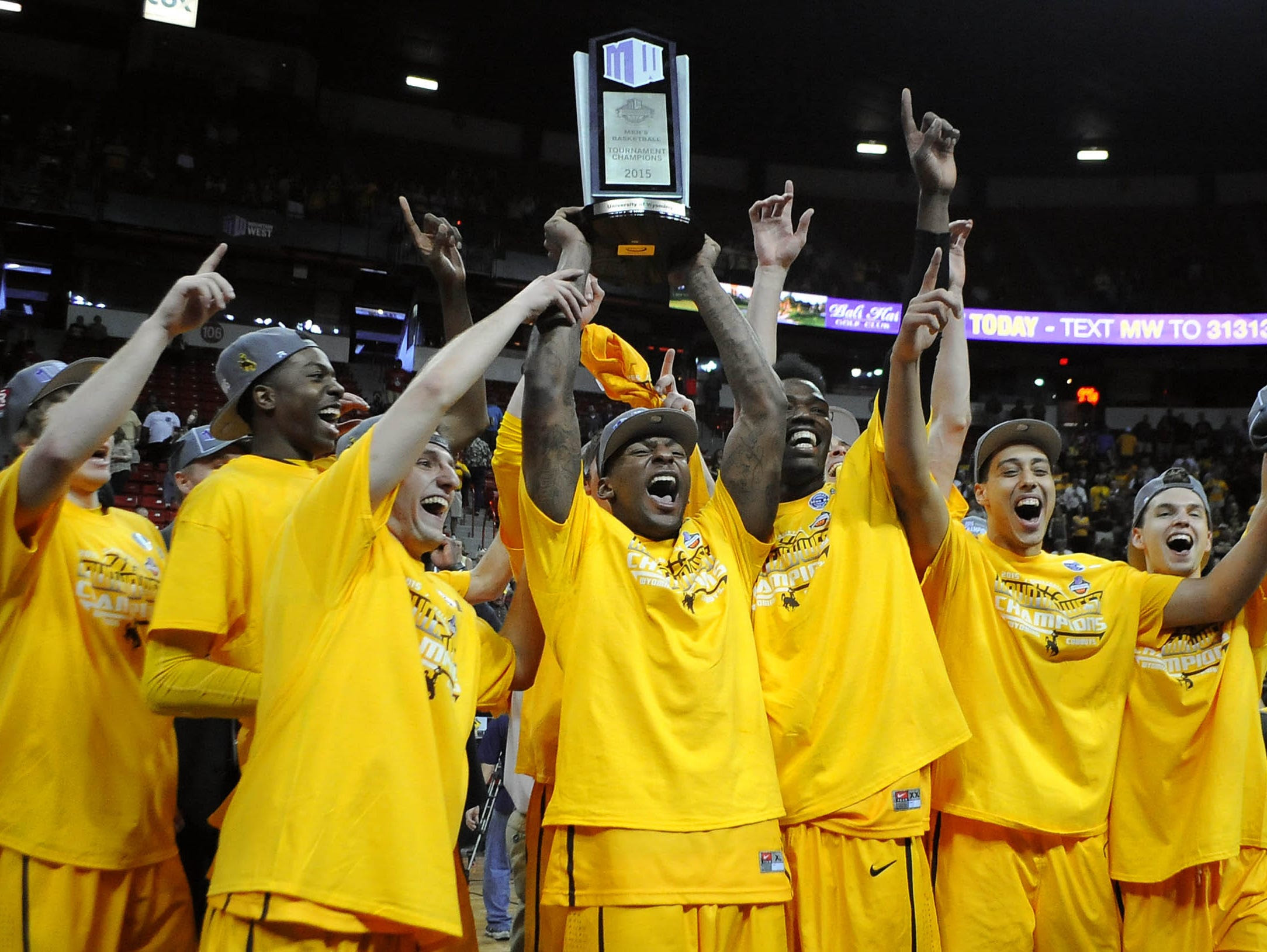 The Wyoming Cowboys celebrate after defeating San Diego State 45-43 in the Mountain West Tournament final.