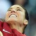 Goalkeeper Hope Solo punched the ball away as Sweden's Amanda Ilestedt (14) tried a header on Friday. The Americans lead their group but have not advanced.