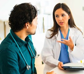 Doctors talking together, with digital tablets and X-rays.