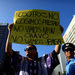 A protester in Puerto Rico whose sign translates as 