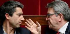 French leftist La France Insoumise (LFI) party leader and member of parliament, Jean-Luc Melenchon (R) and LFI MP Francois Ruffin (L) speak during a debate at the National assembly in Paris on February 5, 2019, prior to vote a controversial anti-rioting bill in a bid to crack down on street violence associated with « yellow vest » anti-government protests. The bill notably aims to allow government officials to ban individuals identified as habitual hooligans from taking part in demonstrations, a measure seen by some as threatening civil liberties and contravening the constitutional right to demonstrate. Those banned could face a six-month prison sentence and a 7,500 euro ($8,500) fine if caught in a demonstration. (Photo by Bertrand GUAY / AFP)