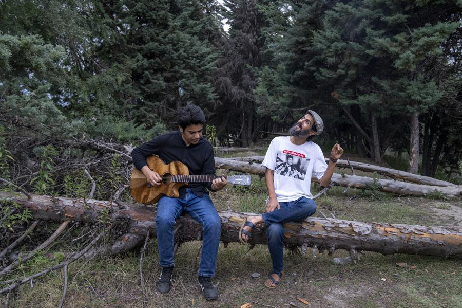 Kashmiri musicians Sarfaraz Javid, right, and Mohsin Hassan Bhat Jam on the outskirts of Srinagar, Indian Kashmir, June 17, 2022.