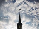 In this file photo, the sun rises behind the steeple of Maranatha Baptist Church Sunday, Aug. 23, 2015, in Plains, Ga. The U.S. Department of Justice has filed a lawsuit against the village of Walthill, Nebraska, a town on the Omaha Reservation. The DOJ claims the town government&#39;s restriction&#39;s on a local church&#39;s construction amounts to discrimination under the federal Religious Land Use and Institutionalized Persons Act. (AP Photo/David Goldman) ** FILE **