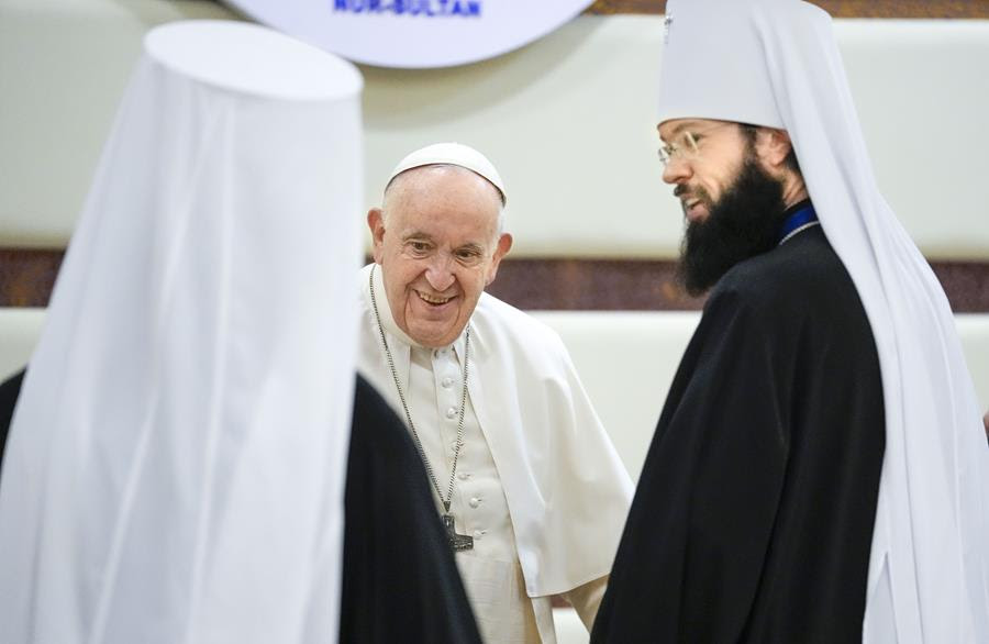 Pope Francis (center) meets with Metropolitan Anthony (right). There is another man to the left with his back to the camera.