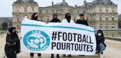 (FILES) Women calling themselves the "Hidjabers" pose with a banner reading in French "#football for all" before playing football in the Luxembourg garden facing the French Senate in Paris on January 26, 2022 as a protest after senators voted last week in favour of a ban of the wearing of religious symbols during events and competitions organised by sports federations. The government is "totally mobilised" to ensure respect for secularism in sport, Elisabeth Borne said on June 27, 2023, after the public rapporteur had defended the possibility for female footballers to wear the hijab on the pitch before the Conseil d'Etat. (Photo by BERTRAND GUAY / AFP)
