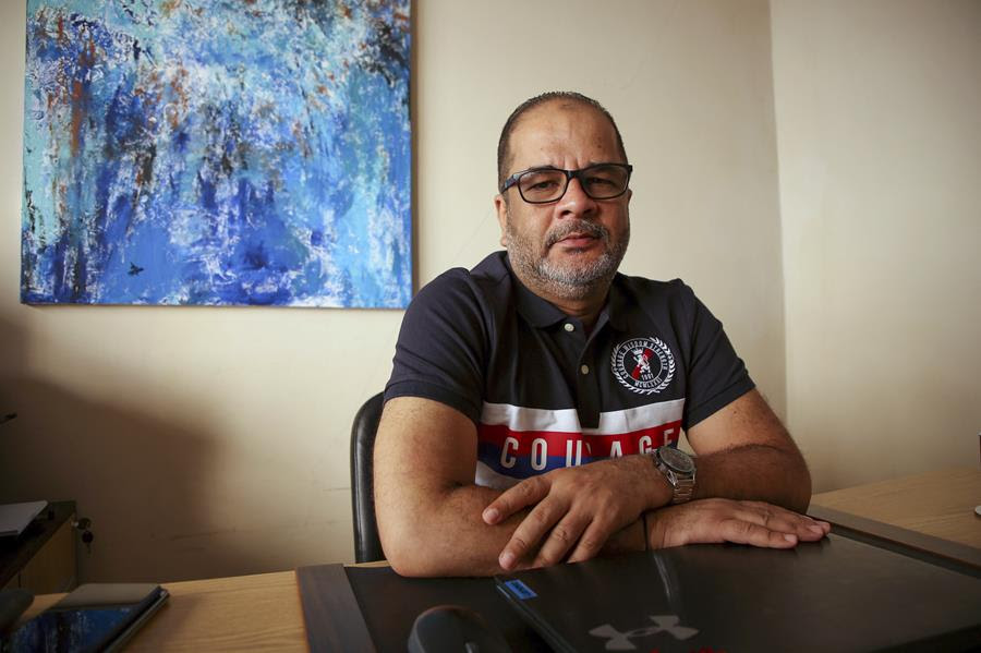 In this Sept. 12, 2021, photo Egyptian Yasser Ebrahim, who was detained in New York following the Sept. 11 attacks, held under no charges and ultimately deported, poses for a photograph in his home, in Alexandria, Egypt.