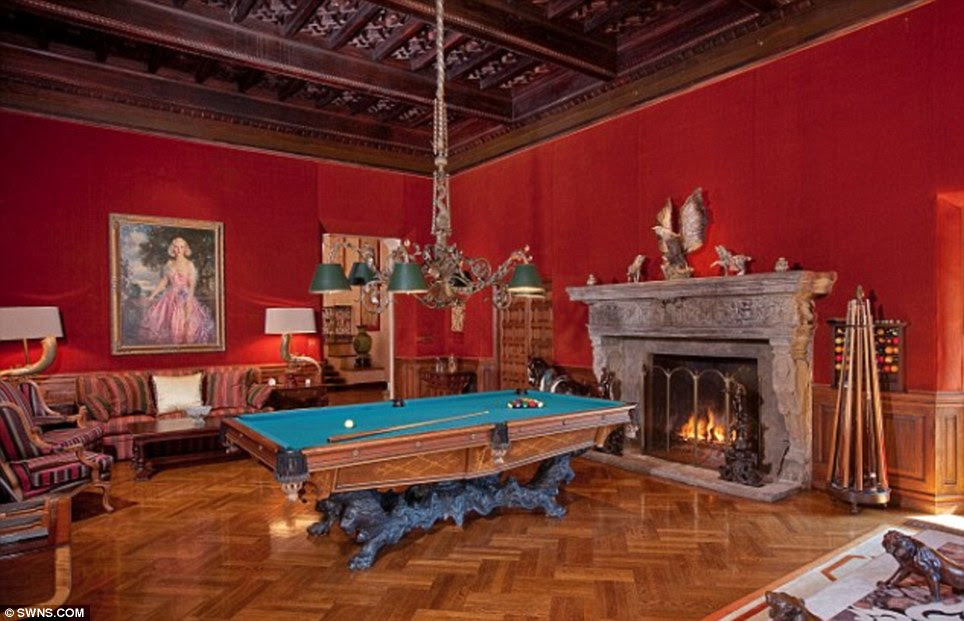 Original features: The parquet floor and stone fireplace in the billiards room were installed when the house was built in the 1920s