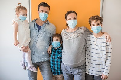 family wearing masks