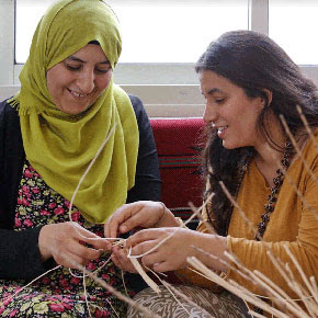 two women weaving