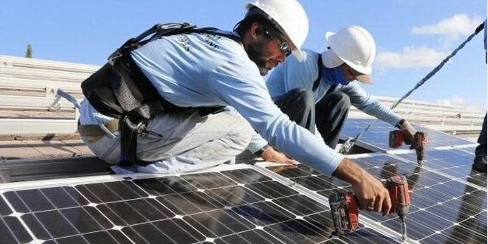 Broward Solar panels Men working on solar panels