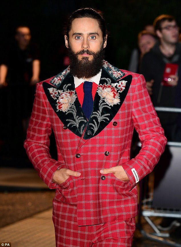 Check you out: The handsome actor, 45, was the picture of confidence as he donned a flamboyant scarlet tweed suit to accept the coveted Actor Of The Year gong