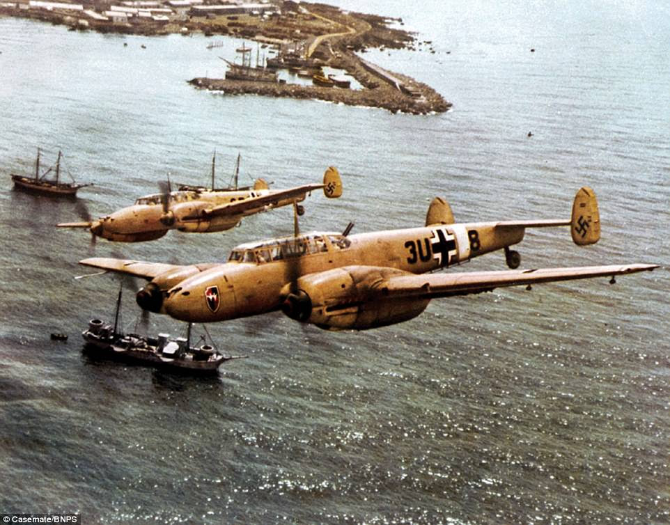 Two Messerschmitt Bf 110 heavy fighters are pictured over the coast of Sicily in 1942. This image is one of 400 brought together for a new book documenting the rise and fall of the Luftwaffe