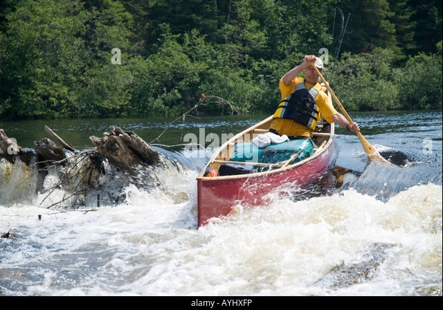 shooting the rapids in a wooden canoe ~ wooden boat plans