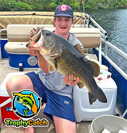 Angler with trophy Florida bass, TrophyCatch logo