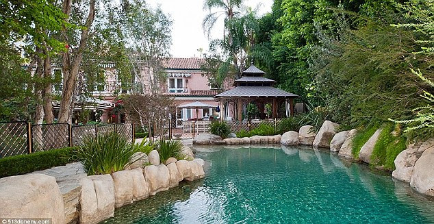 Christina Aguilera's fabulous mansion: 'Wraparound water features' are all the rage with architects building properties for the rich and famous