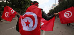 Tunisian demonstrators raise national flags and protest placards as they take to the streets of the capital Tunis, on January 14, 2023, to protest against their president. In July 2021, President Kais Saied sacked the government, froze parliament and seized far-reaching executive powers, later grabbing control of the judiciary -- moves opponents said aimed to install a new dictatorship in the birthplace of the Arab Spring uprisings.
Mohamed Hammi/Sipa Press//HAMMI_HAMMI0329/Credit:HAMMI/SIPA/2301141802
