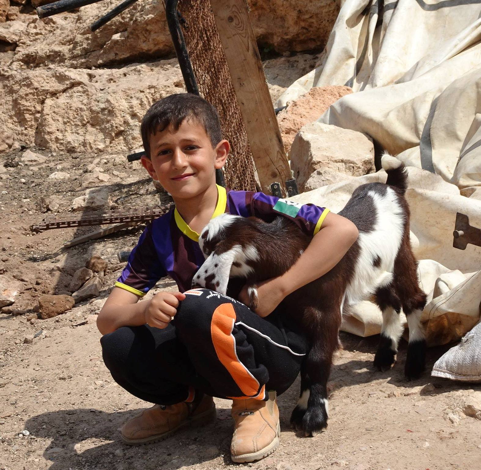 Boy and goat at Khirbet Tana