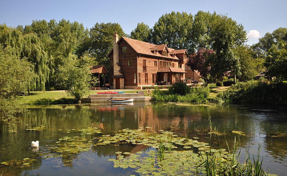 The stunning Tempsford Mill in Bedfordshire which overlooks the River Ivel and includes 6.5 acres of land. It also includes a renovated old mill, a newer extension and outbuildings