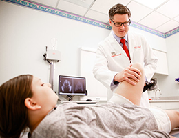 Benjamin Martin examines a patient