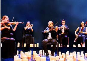 Photo of musicians playing on a stage.