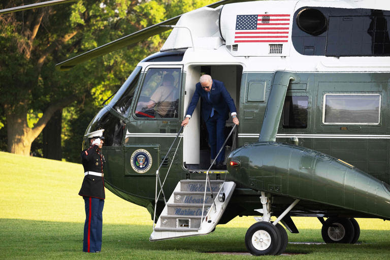 Photo of Joe Boden stepping off of Marine One helicopter.