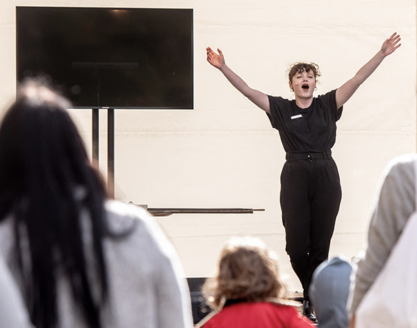 Photograph of a woman giving a performance