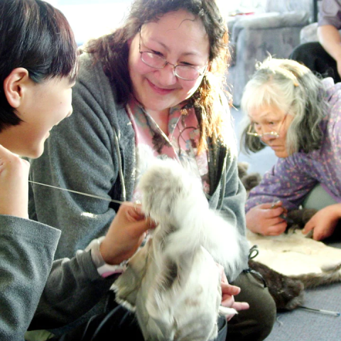 Indigenous Elder helding a Youth
